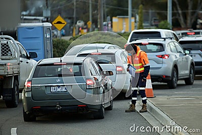 Drivers wait to get tested for Covid-19 at coronavirus drive through testing site in Melbourne Editorial Stock Photo