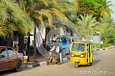 Drivers of yellow tuk tuks ply their trade around the port city Editorial Stock Photo