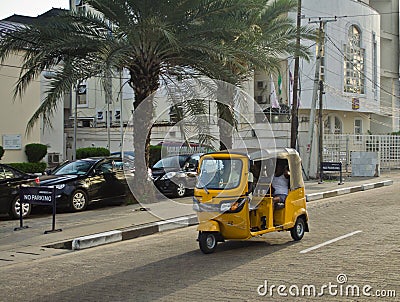 Drivers of yellow tuk tuks ply their trade around the port city Editorial Stock Photo