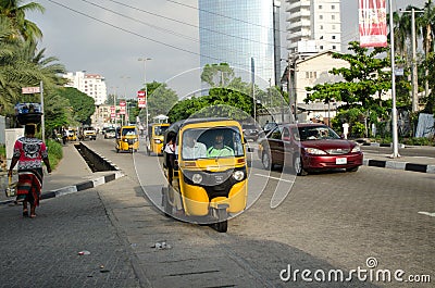 Drivers of yellow tuk tuks ply their trade around the port city Editorial Stock Photo