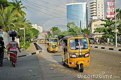 Drivers of yellow tuk tuks ply their trade around the port city Editorial Stock Photo