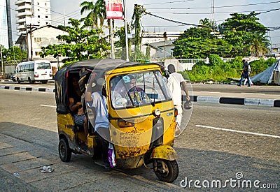 Drivers of yellow tuk tuks ply their trade around the port city Editorial Stock Photo