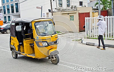 Drivers of yellow tuk tuks ply their trade around the port city Editorial Stock Photo