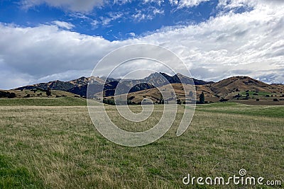 Driving through an agricultural rural sheep station in the highlands of the Southern alps Stock Photo