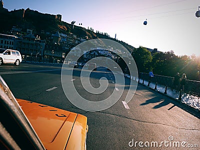 Driving around Tbilisi in yellow old russian taxi Editorial Stock Photo