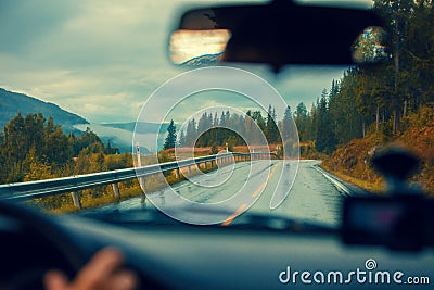 Driving a car on the mountain road Stock Photo