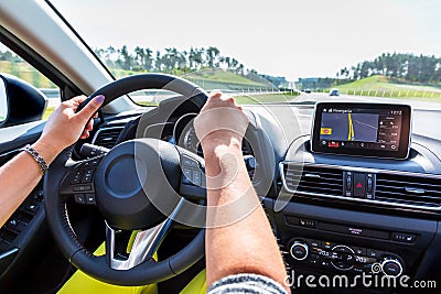 Driving a car with navigation Stock Photo