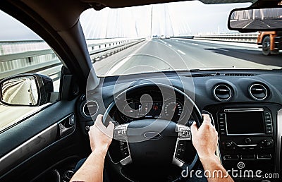 Driving car pov on a highway - Point of View Stock Photo