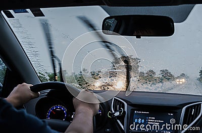 Driving the car on the road on a rainy day Editorial Stock Photo