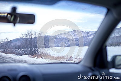 Driving a car on a winter road Stock Photo