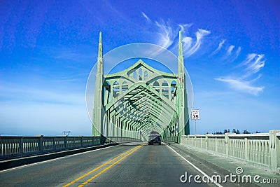 Driving on the Conde B. McCullough Memorial Bridge, Oregon, formerly the Coos Bay Bridge, on a sunny day Stock Photo