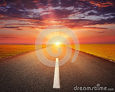 Driving on an empty asphalt road at sunset Stock Photo