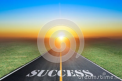 Driving on an empty asphalt road towards the setting sun and sign which symbolizing success. Stock Photo