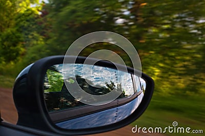 Driving through the forest by car Stock Photo