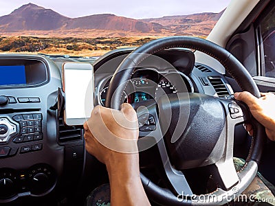 Driving FWD off road in mountain terrian with GPS on smart phone. Stock Photo