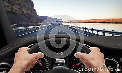 Driving hands steering wheel Stock Photo