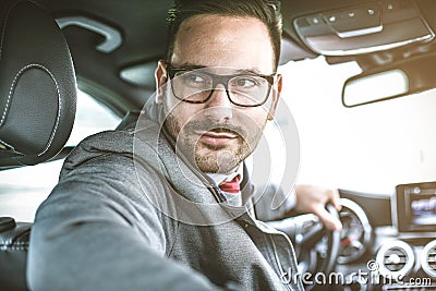 Driving his car. Stock Photo