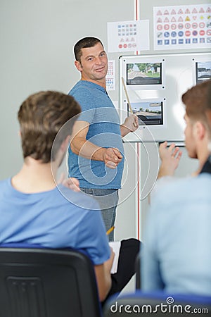 Driving instructor explaing road theory Stock Photo