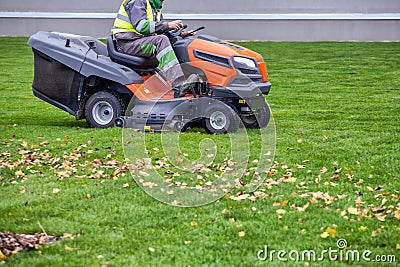 Driving lawn tractor mower Stock Photo