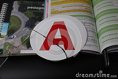 Driving lessons. Books of traffic rules in France, pen, glasses, A sticker. Stock Photo