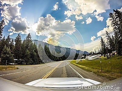 Driving through montana vast mountain landscapes, Stock Photo