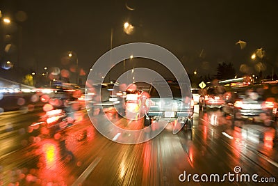 Driving in the rain on freeway at night Stock Photo