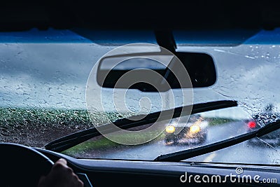 Driving on the road on a rainy day Stock Photo