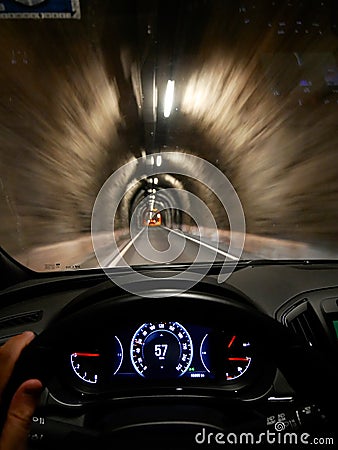 Driving thru a narrow tunnel seen from driver perspective Stock Photo