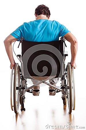 Driving a wheelchair Stock Photo
