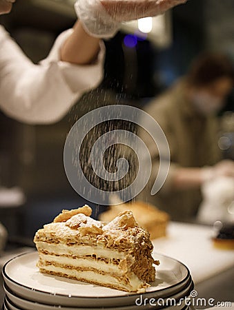 Drizzle sprinkled on slice of cake Stock Photo