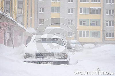 Drohobych, Ukraine - March15, 2013: Mercedes-benz and other cars blocked by snow, snow-paralysis of traffic, snow covered street, Editorial Stock Photo