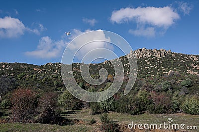 Drone flying over the ground while taking pictures with its built-in camera Stock Photo