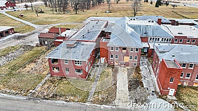 Drone aerial of Byron Health Center demolition with side view of abandoned old hospital deconstruction Stock Photo