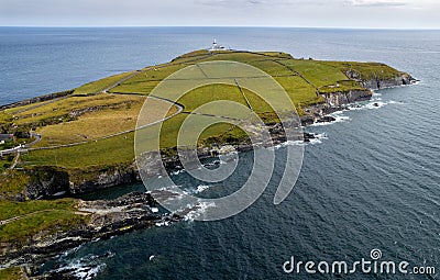 Drone aerial of galley head lighthouse. Dundeady headland island cork county ireland Stock Photo