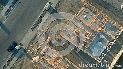 Drone Aerial View of Home Construction Site Foundations and Framing Stock Photo