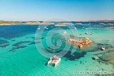 Drone aerial view of catamaran sailing boat in Maddalena Archipelago, Sardinia, Italy. Stock Photo