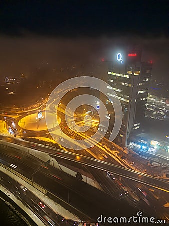 Drone aerial view of Europa Bussines and Shopping center in city of Banska Bystrica during winter evening Editorial Stock Photo