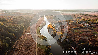 Drone with a camera, beautiful river through career and forest. C Stock Photo