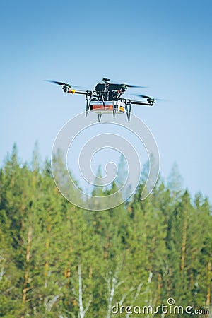 Drone carrying package Stock Photo