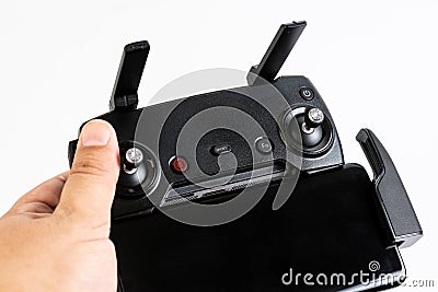 Drone controler with mobile phone in the hand isolated above white background Stock Photo