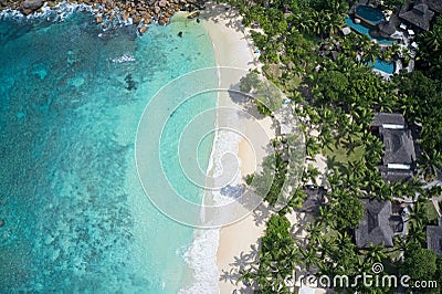 Drone field of view of coastline and houses with spectacular blue bay on Praslin, Seychelles Stock Photo