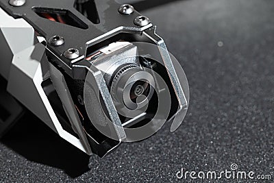 drone first person view flying combat device front side with gimbal camera lens element studio workshop concept picture Stock Photo