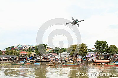 Drone flying above river in Manado Editorial Stock Photo
