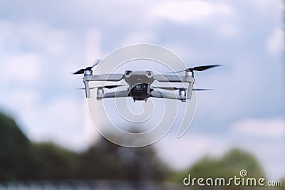 Drone flying in a city park. DJI Mavic Air 2 in the air at Munich Olympiapark. Editorial Stock Photo