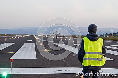 Drone inspection over airport runway with operator Stock Photo
