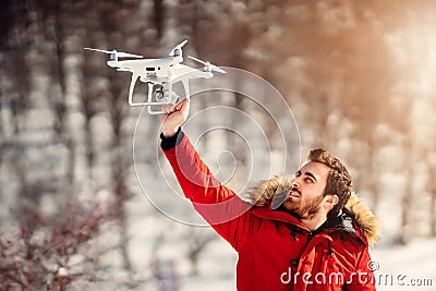 Drone operator, drone pilot holding small compact drone Stock Photo