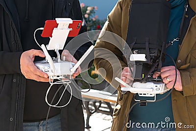 Drone operator using a remote control. Stock Photo
