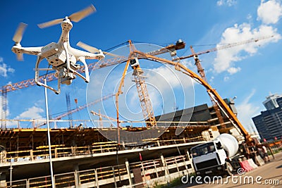 Drone over construction site. video surveillance or industrial inspection Stock Photo