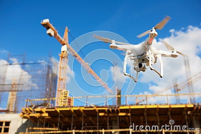 Drone over construction site. video surveillance or industrial inspection Stock Photo