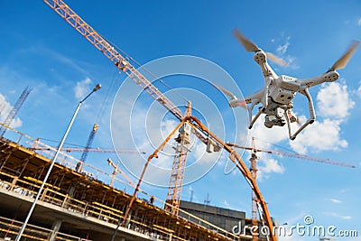 Drone over construction site. video surveillance or industrial inspection Stock Photo